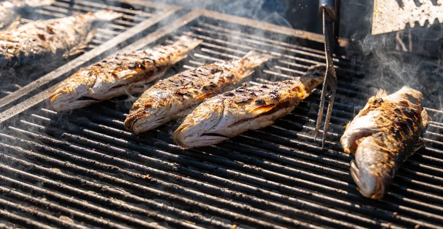 Whole fish grilling over the fire